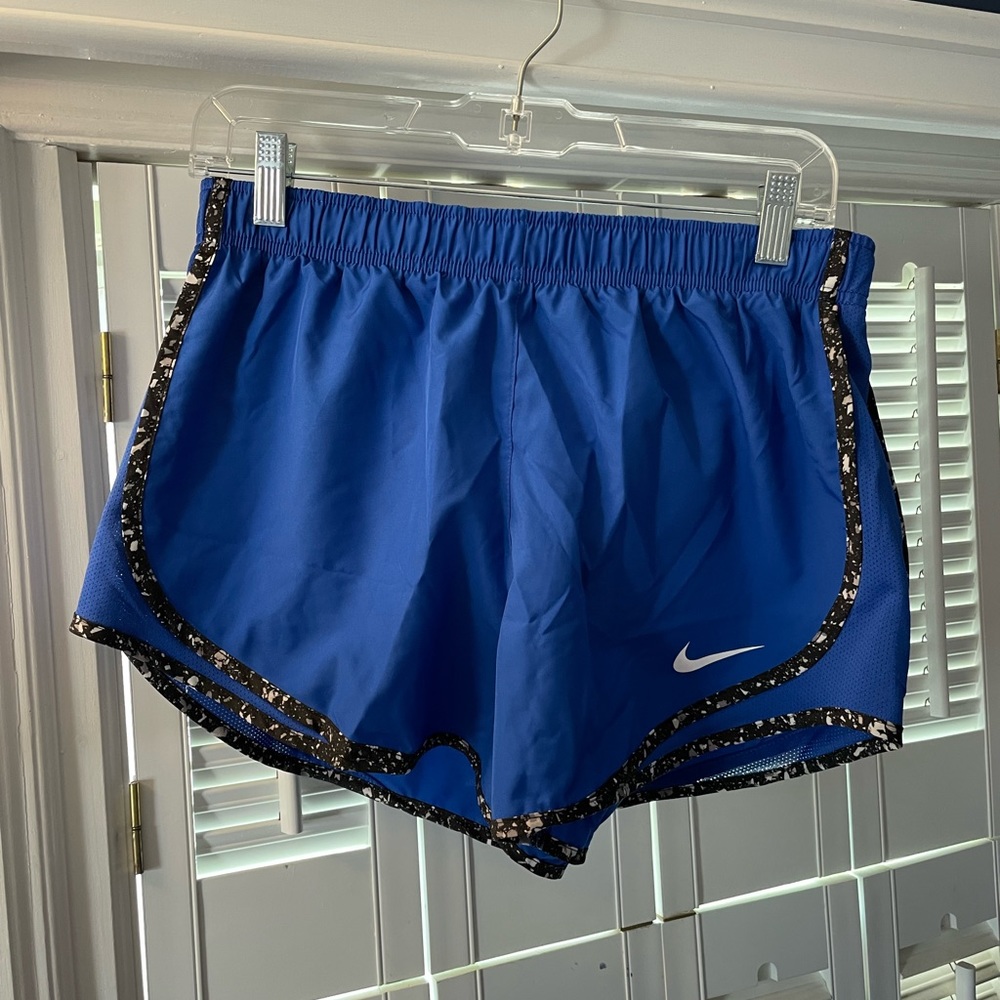 Blue Nike athletic shorts.